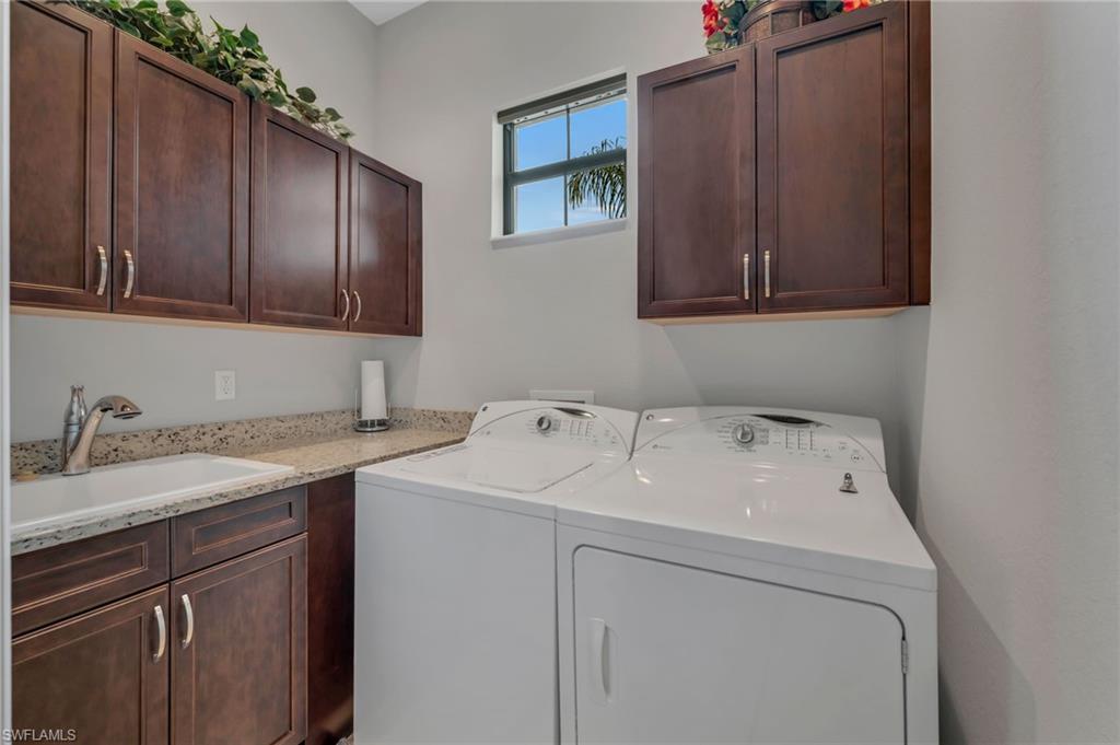 6714 Canwick Cove Circle Naples, FL 34113 - Photo 16 of 23 a utility room with dryer and washer