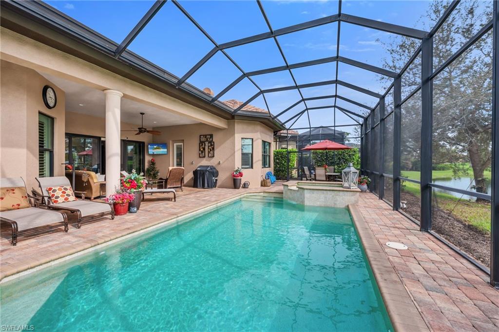 6714 Canwick Cove Circle Naples, FL 34113 - Photo 18 of 23 a view of swimming pool with a patio