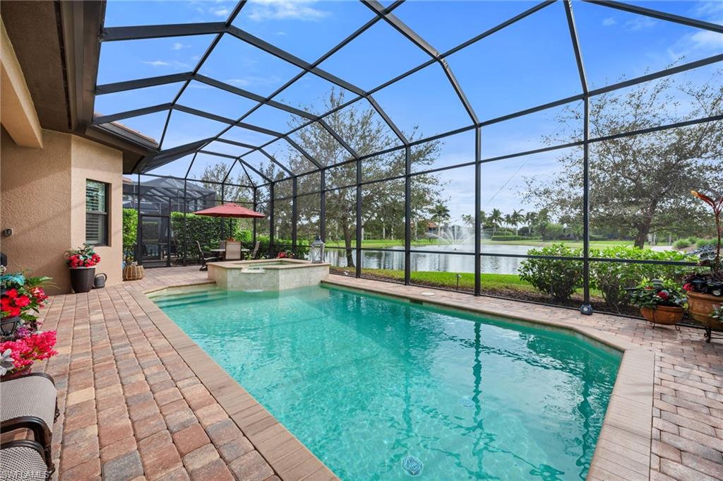 6714 Canwick Cove Circle Naples, FL 34113 - Photo 19 of 23 a view of swimming pool with a patio