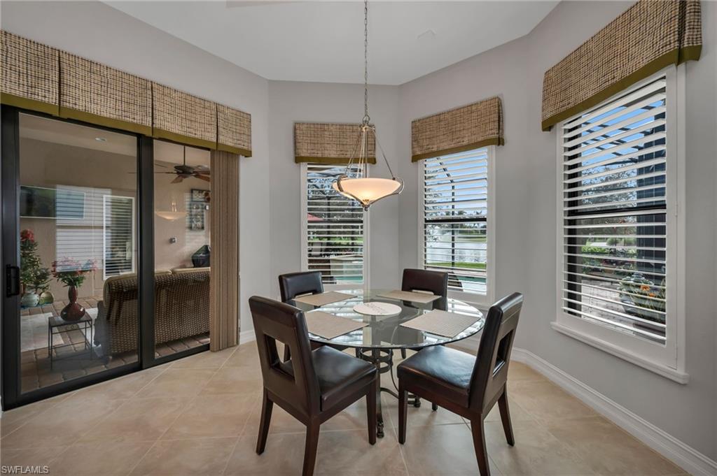 6714 Canwick Cove Circle Naples, FL 34113 - Photo 7 of 23 a dining room with furniture and window