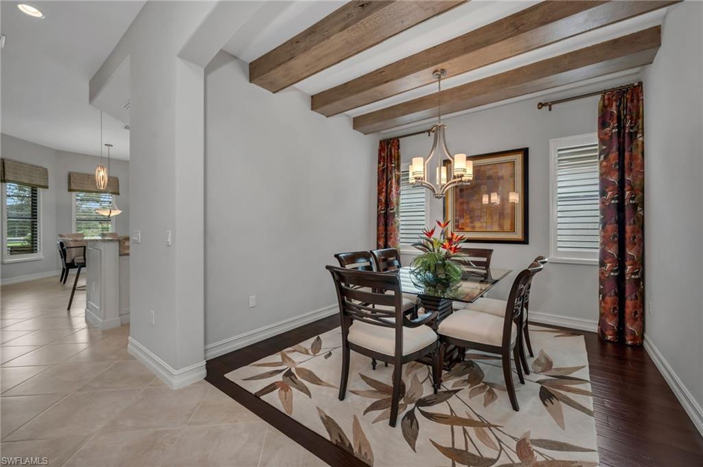 6714 Canwick Cove Circle Naples, FL 34113 - Photo 8 of 23 a dining room with furniture and window