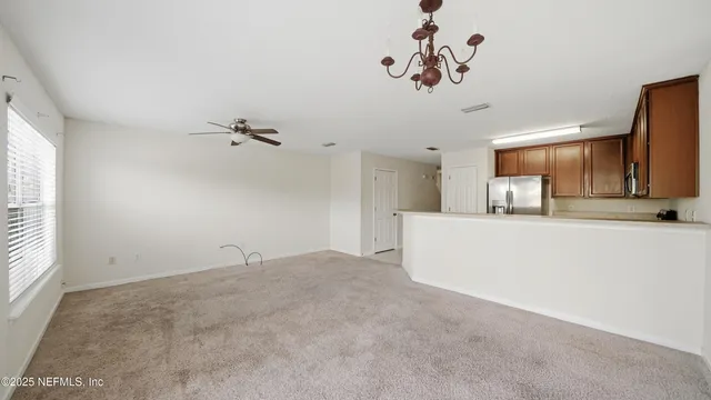 a view of a kitchen with a sink and a window