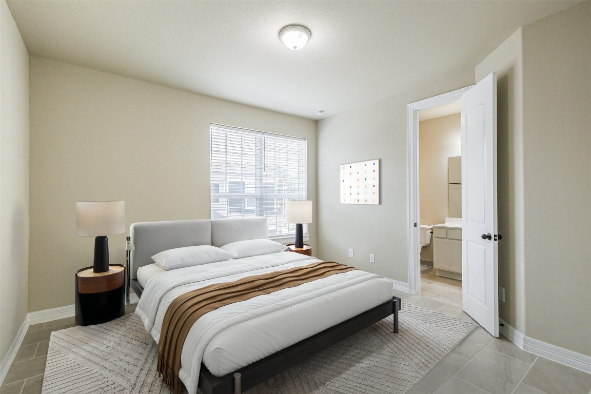 11005 Cres Light Way Houston, TX 77043 - Photo 15 of 22 a bedroom with a bed and a window