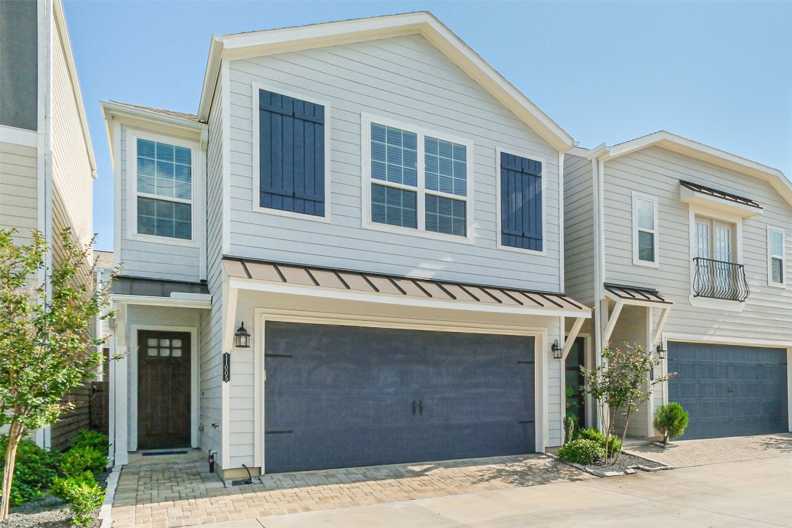 11005 Cres Light Way Houston, TX 77043 - Photo 21 of 22 a front view of a house with a yard