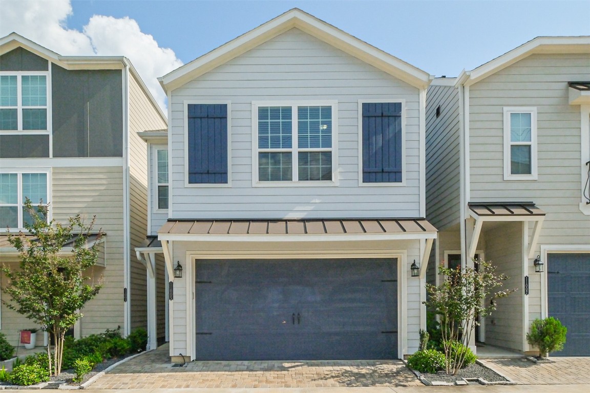 11005 Cres Light Way Houston, TX 77043 - Photo 22 of 22 a front view of a house with garden