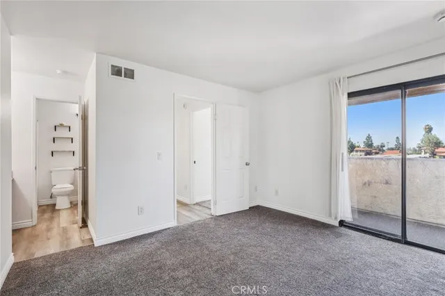 a view of a room with white doors