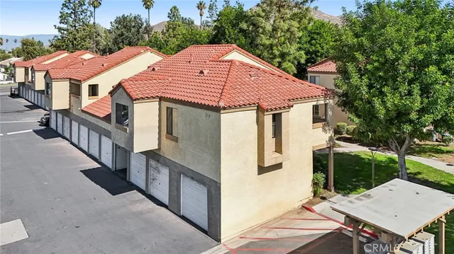 a aerial view of a house with yard and furniture