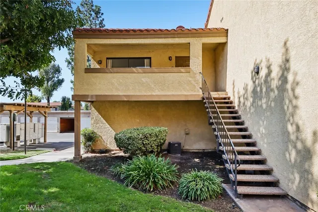a view of a yard with potted plants
