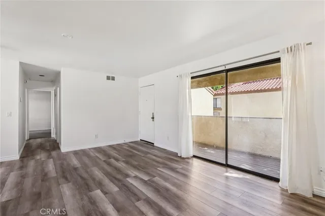 a view of an empty room and window