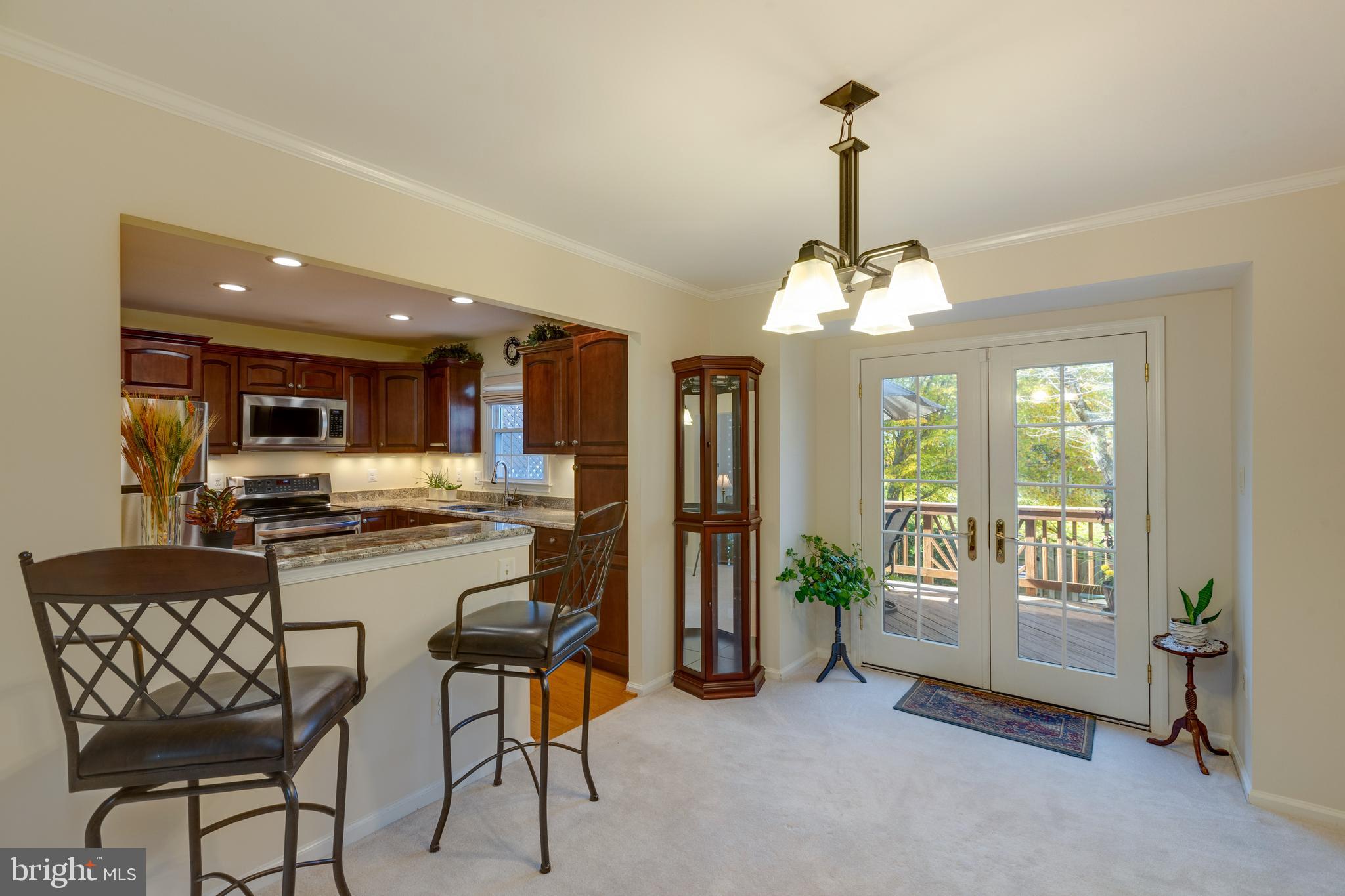 7940 Forest Path Way Springfield, VA 22153 - Photo 11 of 49 The dining room opens up to the deck via french do