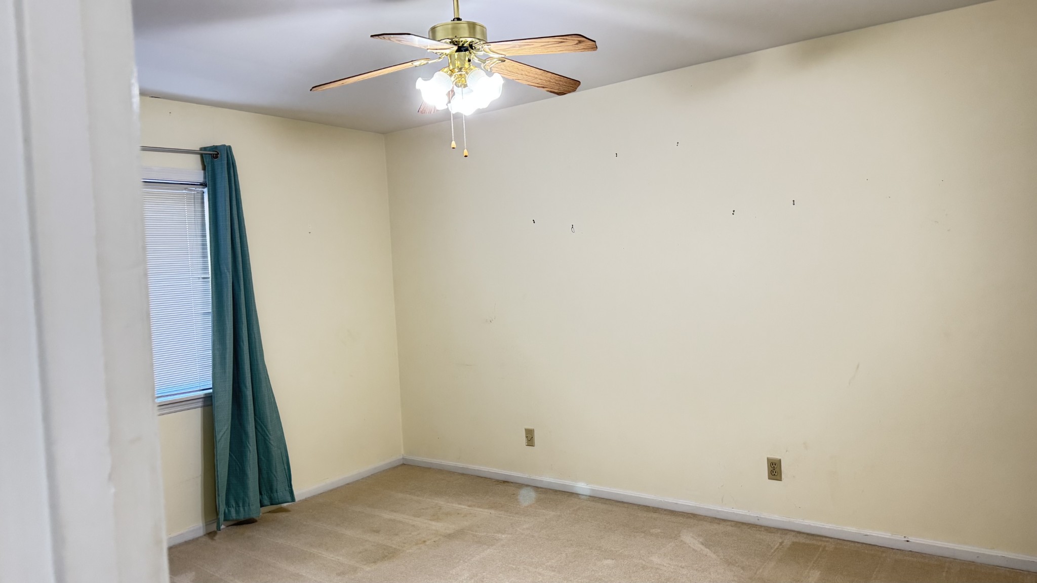162 Pembroke Oak Grove Road Oak Grove, KY 42262 - Photo 16 of 17 an empty room with a window and a fan