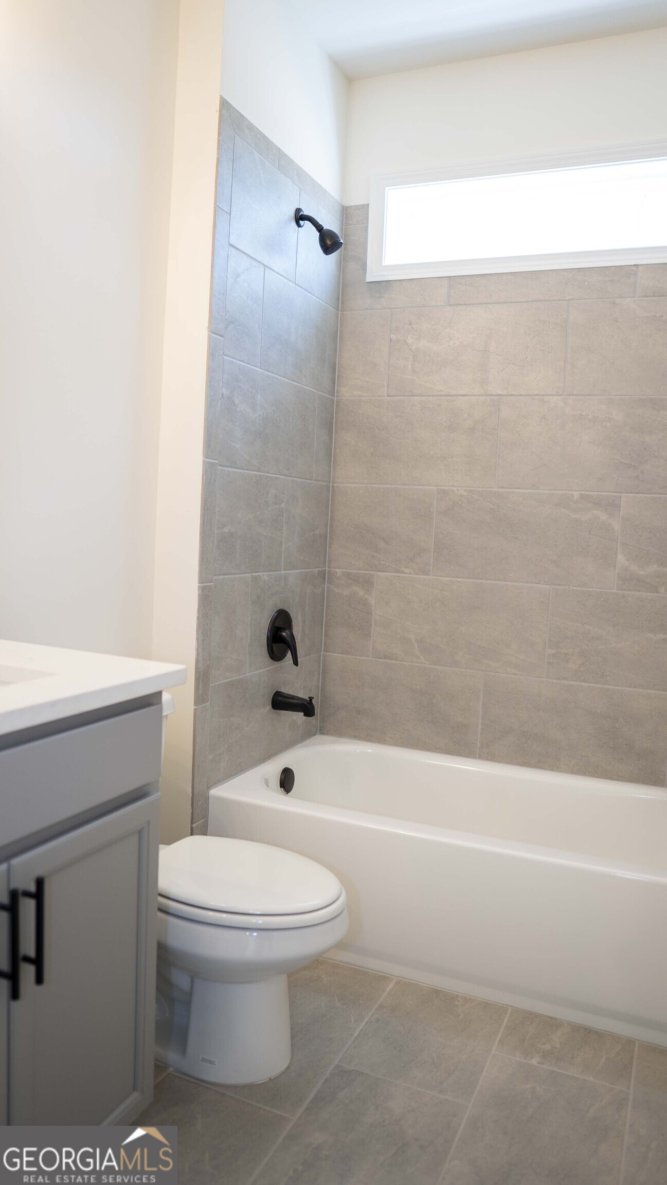 604 Beaver Court Perry, GA 31069 - Photo 27 of 40 a bathroom with a toilet and a shower