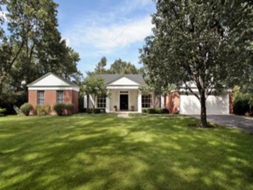 1195 Hill Road Winnetka, IL 60093 - Photo 1 of 1 a front view of a house with a garden
