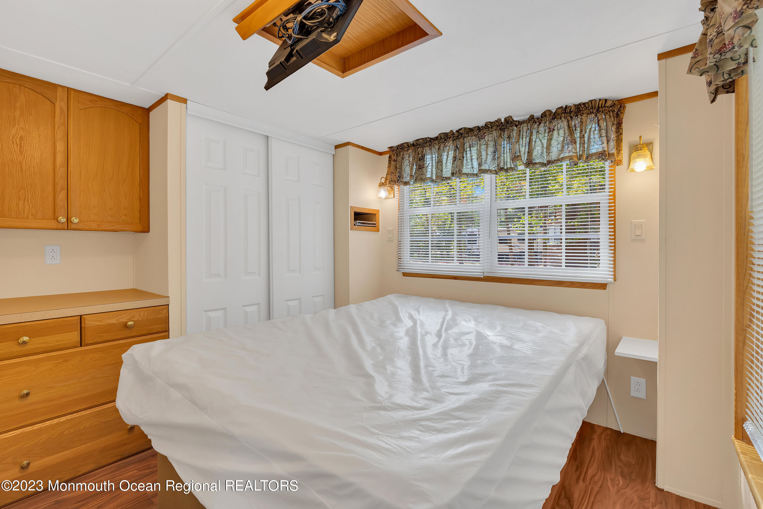 724 Monmouth Road, Unit 33 Cream Ridge, NJ 08514 - Photo 11 of 27 a spacious bedroom with a bed and wooden floor
