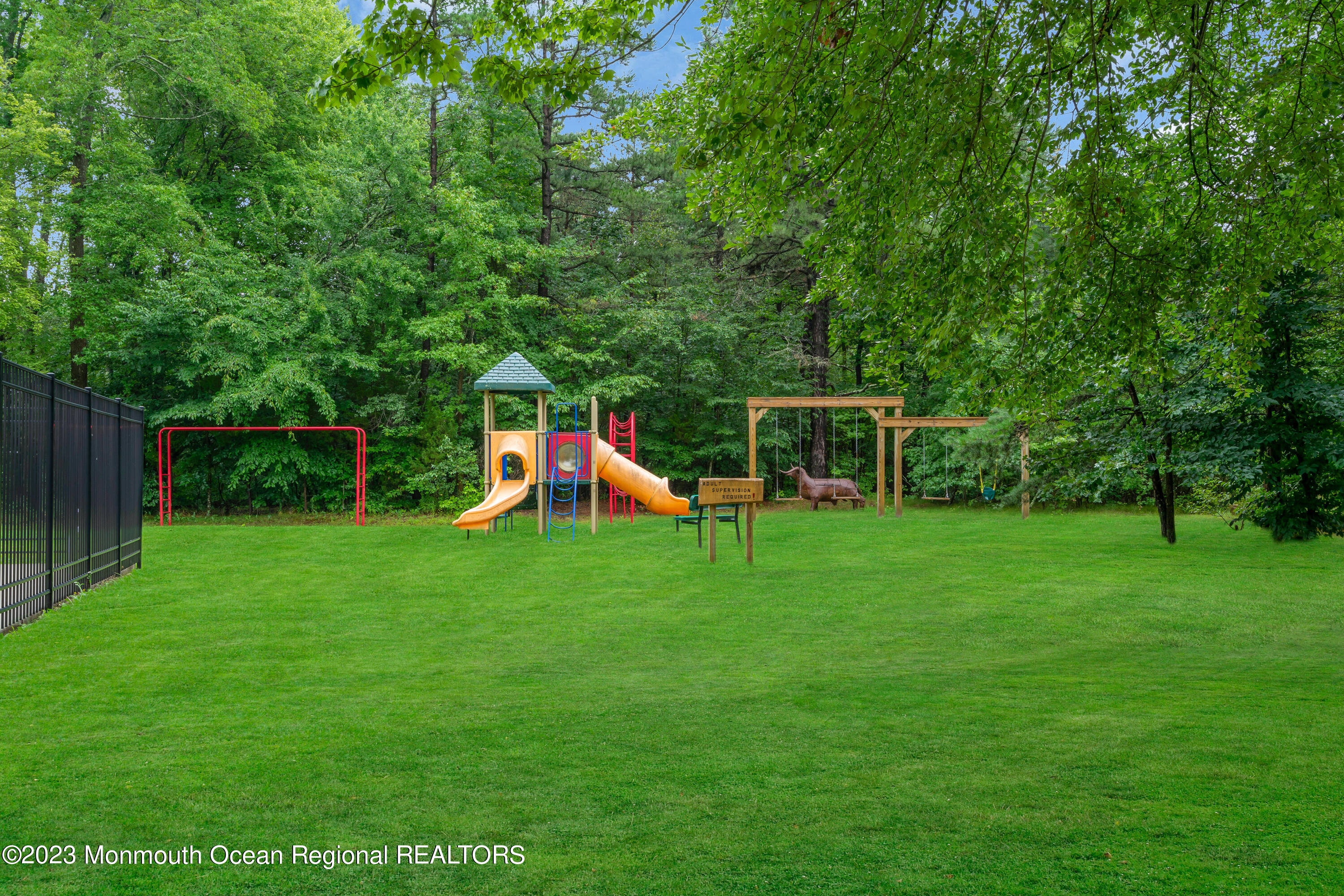 724 Monmouth Road, Unit 33 Cream Ridge, NJ 08514 - Photo 22 of 27 a view of a backyard with a garden and trees