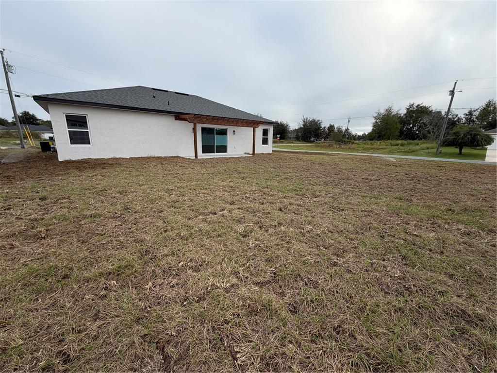 6790 Southwest 129th Street Ocala, FL 34473 - Photo 4 of 23 a big room with yard