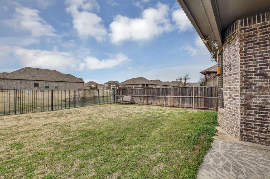 1306 Elizabeth Street Anna, TX 75409 - Photo 33 of 36 Fenced backyard featuring a residential view and a patio
