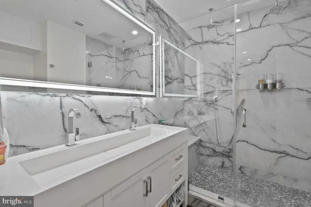 a bathroom with a sink and mirror