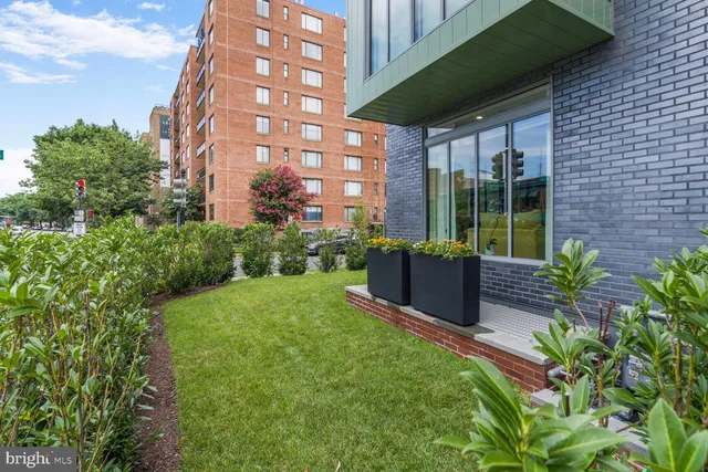 a view of a building with a garden