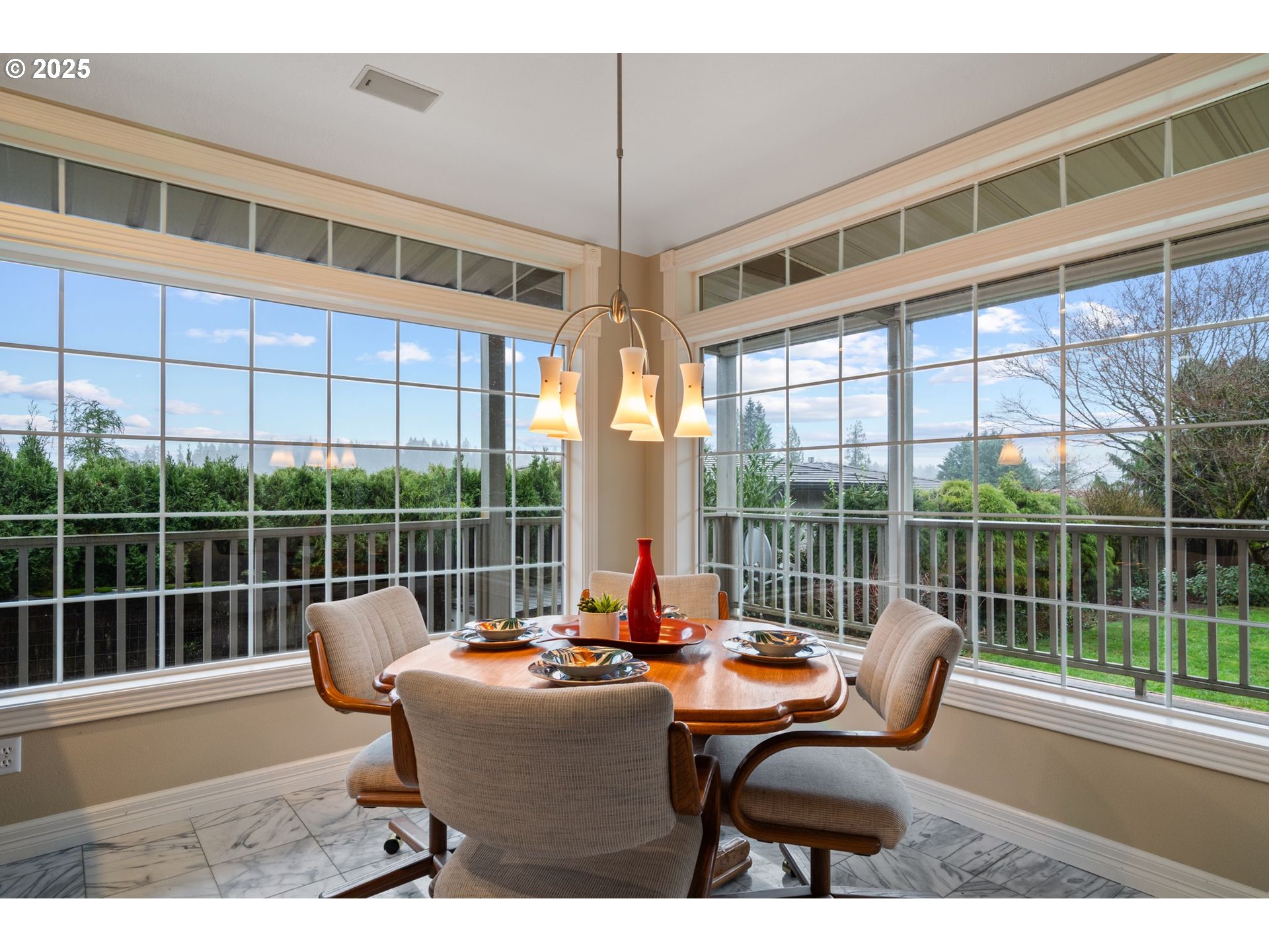 5150 Northwest Valley Court Camas, WA 98607 - Photo 18 of 48 a view of a dining room with furniture large windows and wooden floor