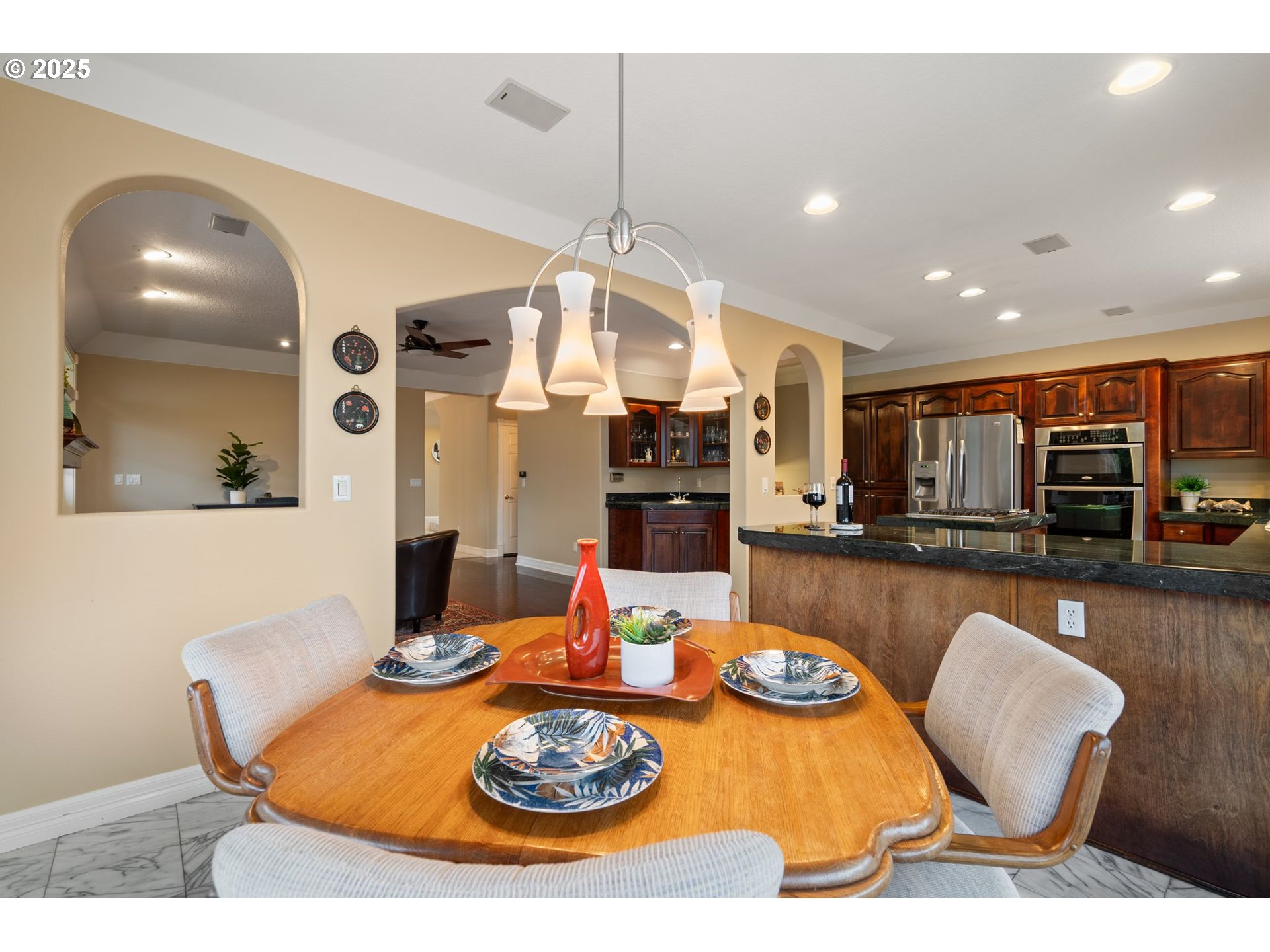 5150 Northwest Valley Court Camas, WA 98607 - Photo 19 of 48 a dining room with furniture a table and kitchen view