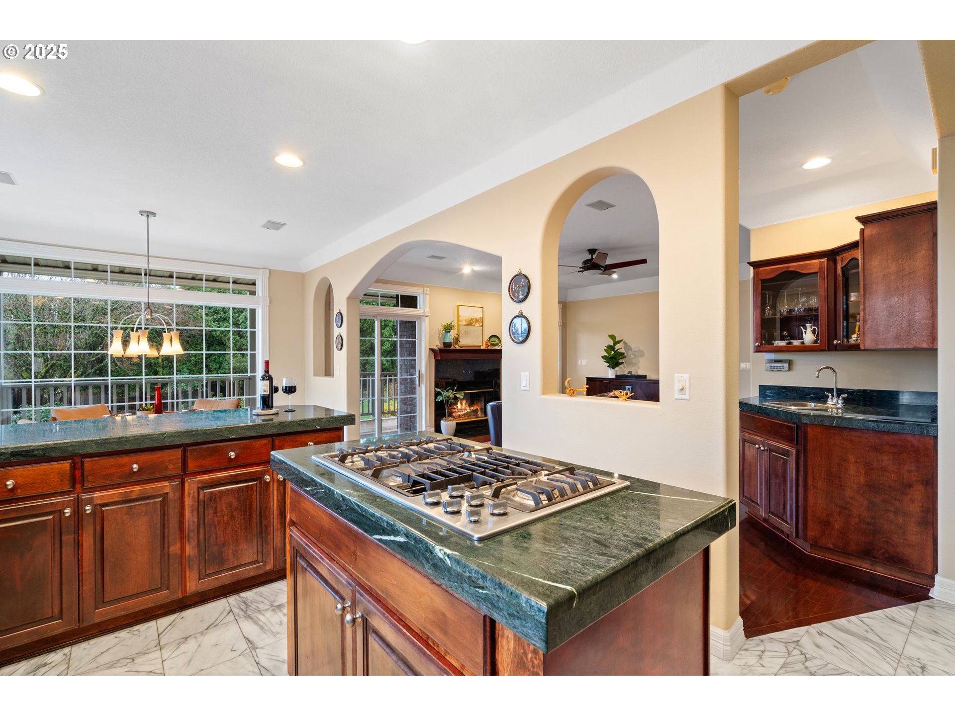 5150 Northwest Valley Court Camas, WA 98607 - Photo 24 of 48 a kitchen with stainless steel appliances granite countertop a stove a sink dishwasher and a wooden cabinets
