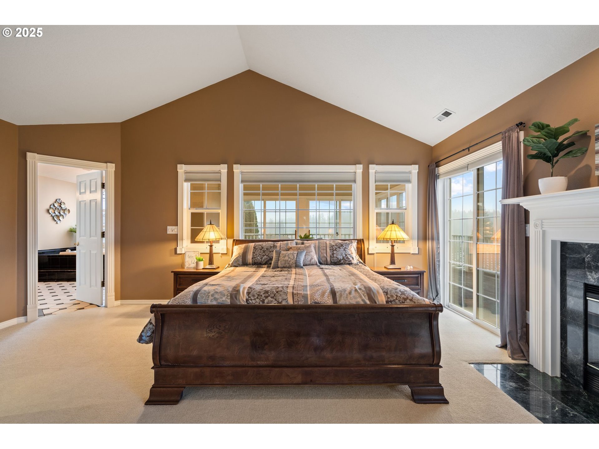 5150 Northwest Valley Court Camas, WA 98607 - Photo 28 of 48 a bedroom with a large bed and a large window