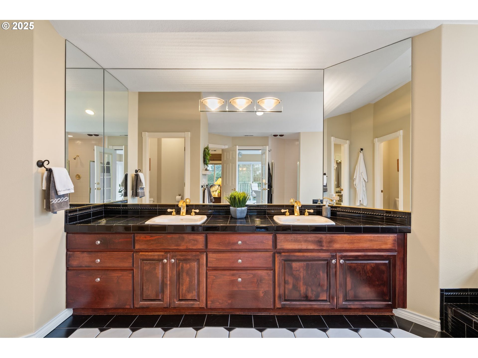 5150 Northwest Valley Court Camas, WA 98607 - Photo 30 of 48 a bathroom with a granite countertop sink a mirror and a shower