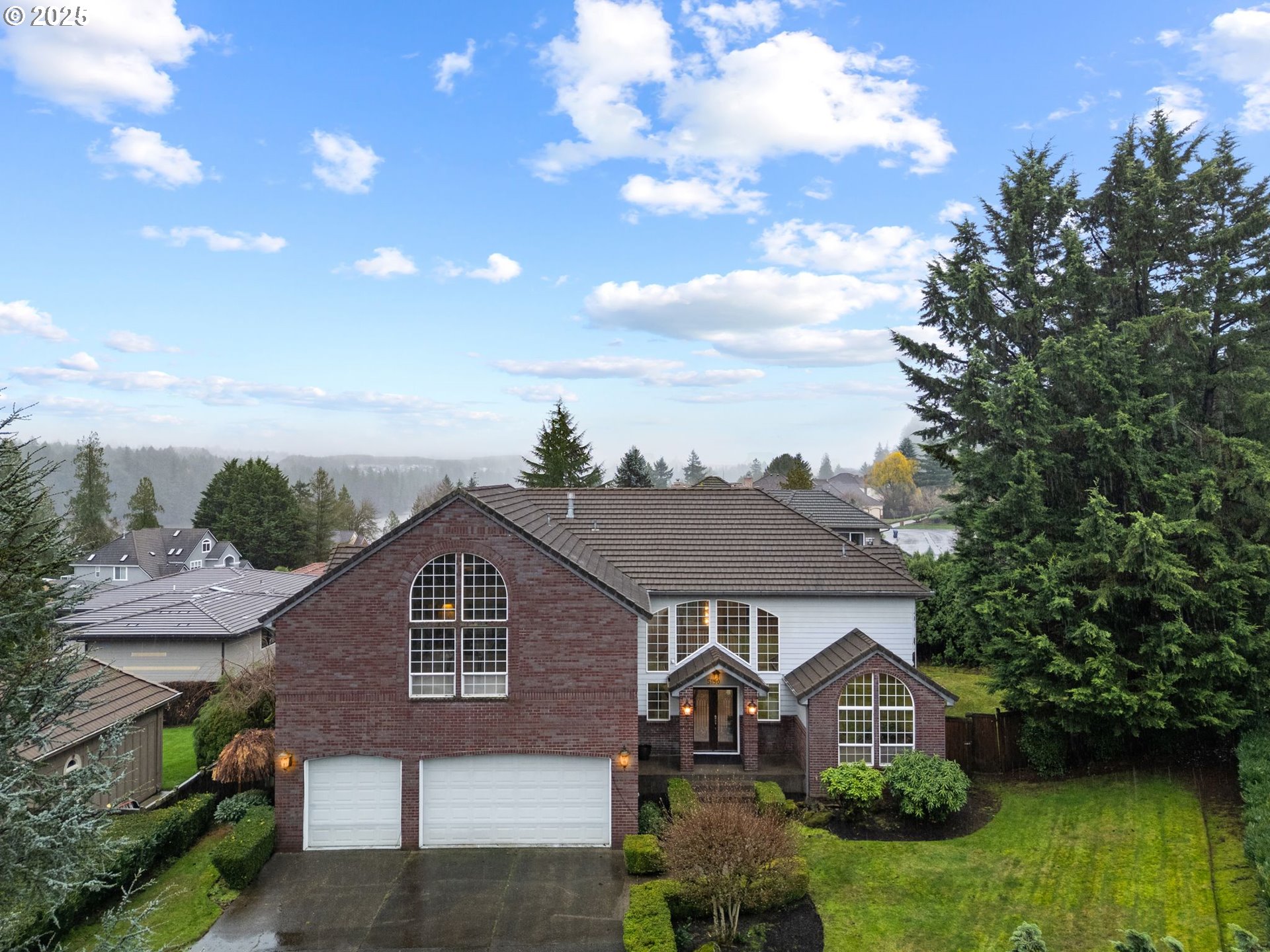 5150 Northwest Valley Court Camas, WA 98607 - Photo 3 of 48 a front view of a house with garden