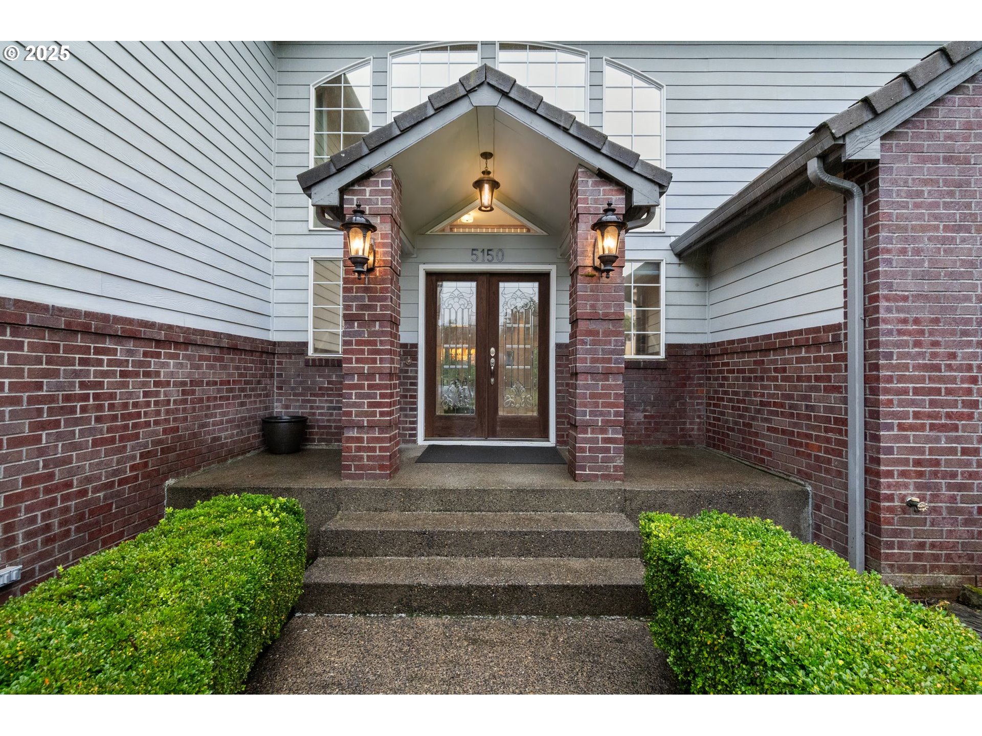 5150 Northwest Valley Court Camas, WA 98607 - Photo 4 of 48 a front view of a house with garden