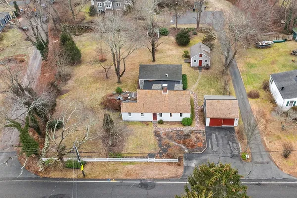 an aerial view of residential houses with outdoor space
