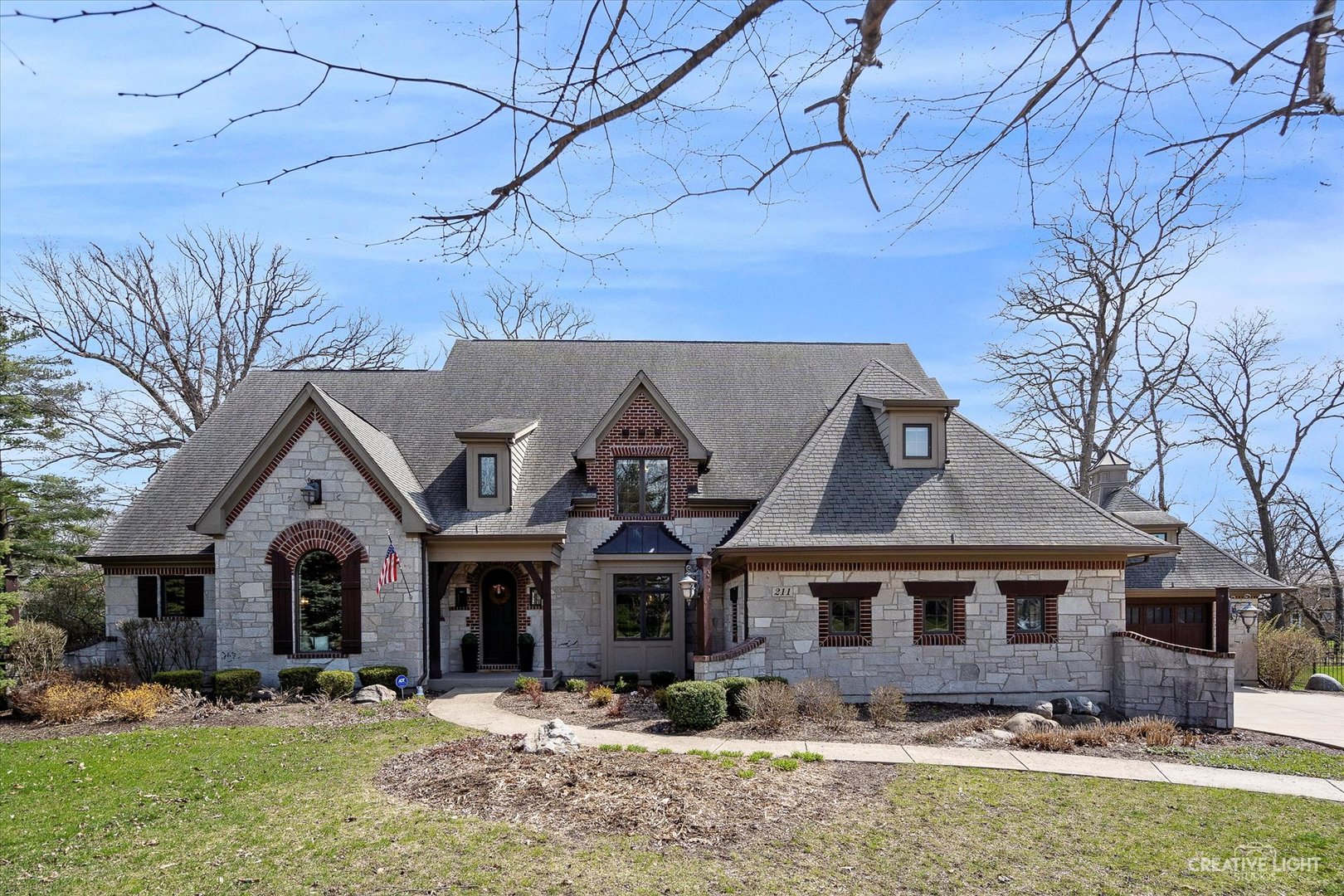 a front view of a house with a yard