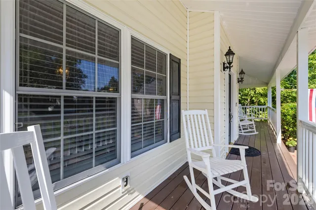 a view of balcony with furniture