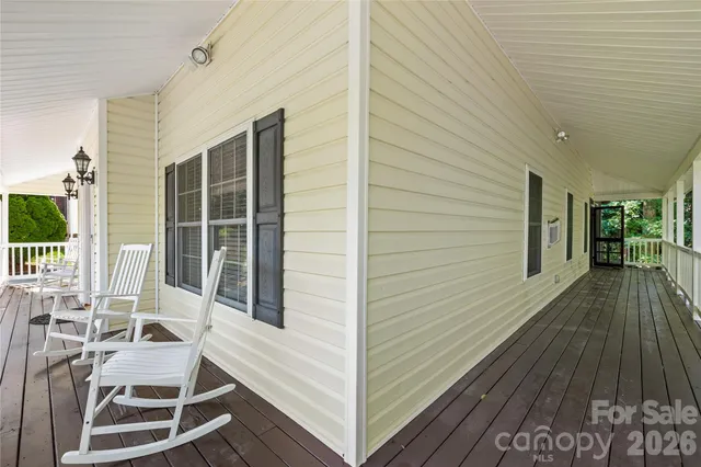 a view of a patio with table and chairs
