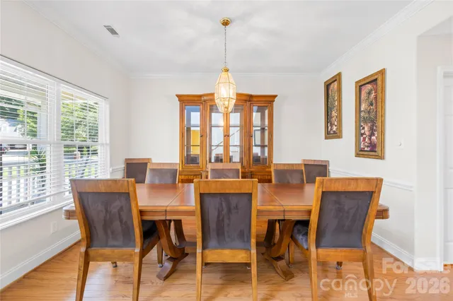 a dining room with furniture window wooden floor