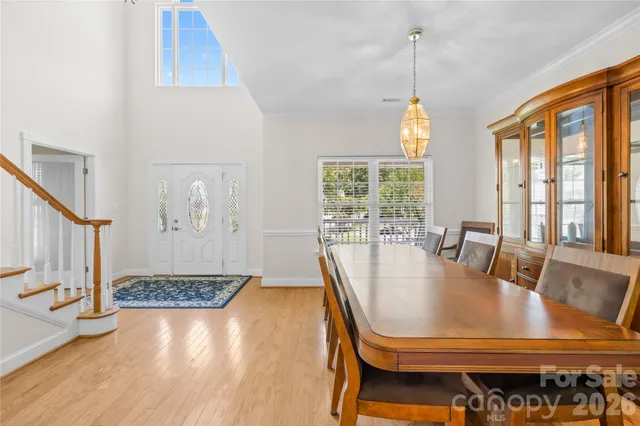 a living room with pool table and a large window