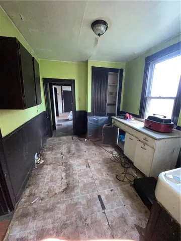 a view of a room with window and furniture