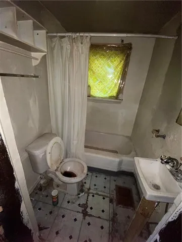 a bathroom with a sink and a toilet