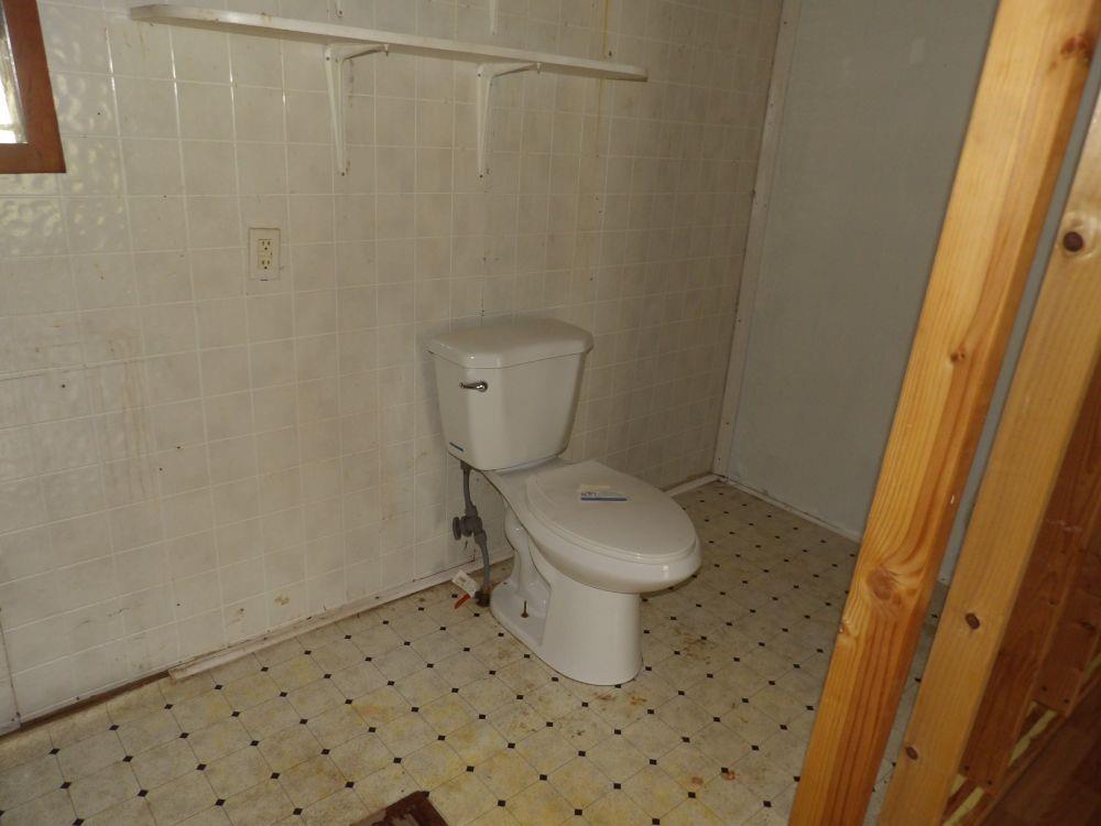 53 Donation Road Greenville, PA 16125 - Photo 5 of 11 a bathroom with a toilet and a shower curtain