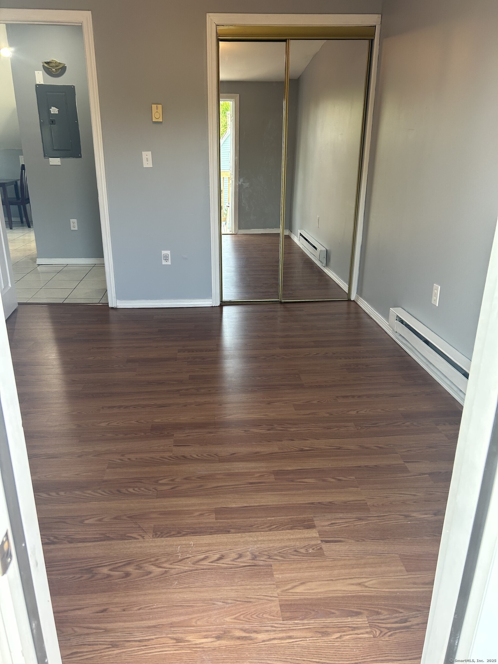 280 Bassett Street New Haven, CT 06511 - Photo 9 of 9 wooden floor in an empty room with a mirror