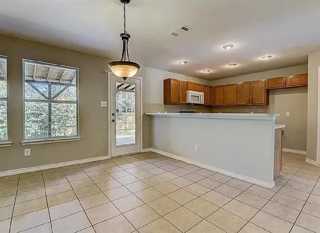 a view of a kitchen with windows