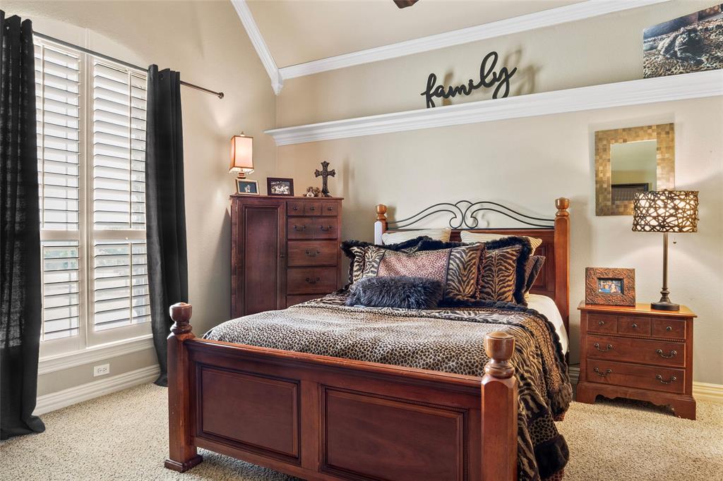 419 East Hickory Ridge Circle Argyle, TX 76226 - Photo 19 of 37 a bed sitting in a bedroom next to a window