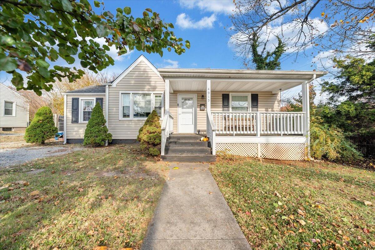4915 Hildebrand Road Northwest Roanoke, VA 24012 - Photo 1 of 40 a front view of a house with a garden