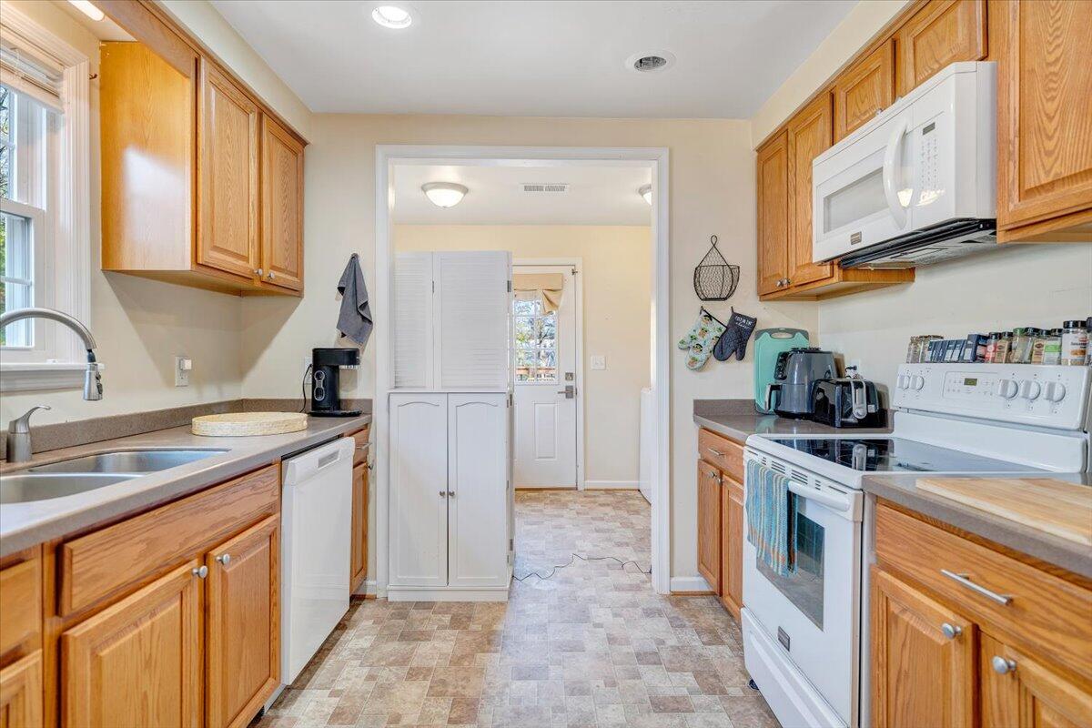 4915 Hildebrand Road Northwest Roanoke, VA 24012 - Photo 11 of 40 a kitchen with stainless steel appliances granite countertop a stove a sink and a refrigerator