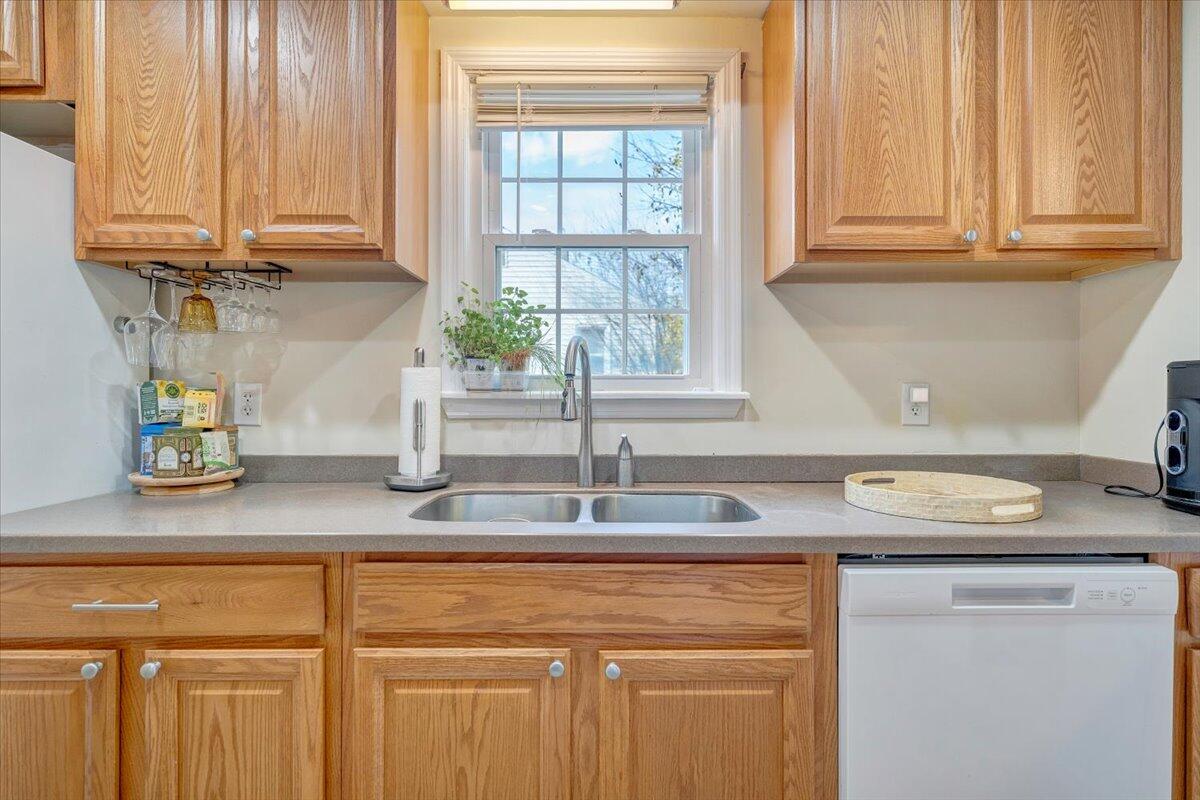 4915 Hildebrand Road Northwest Roanoke, VA 24012 - Photo 14 of 40 a kitchen with stainless steel appliances granite countertop a sink and a white cabinets