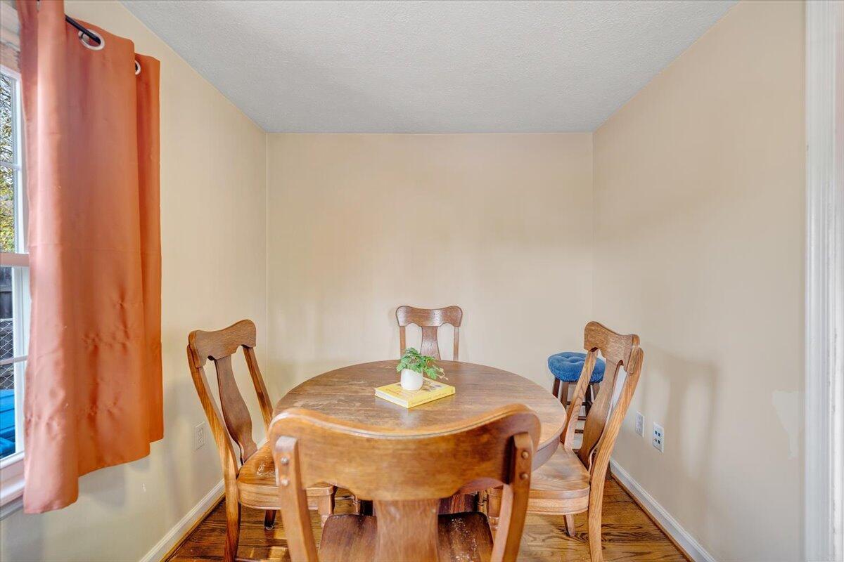 4915 Hildebrand Road Northwest Roanoke, VA 24012 - Photo 16 of 40 a view of a dining room with furniture and wooden floor