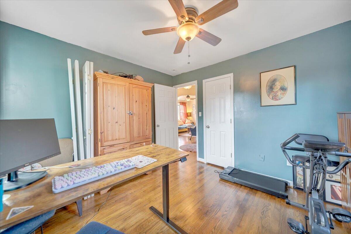 4915 Hildebrand Road Northwest Roanoke, VA 24012 - Photo 20 of 40 a room with chandelier fan and windows