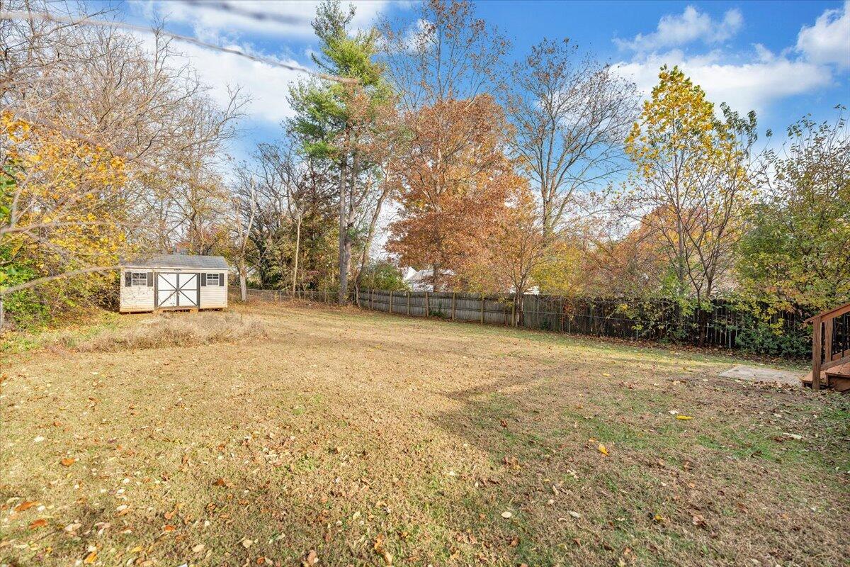 4915 Hildebrand Road Northwest Roanoke, VA 24012 - Photo 31 of 40 a street view with large trees