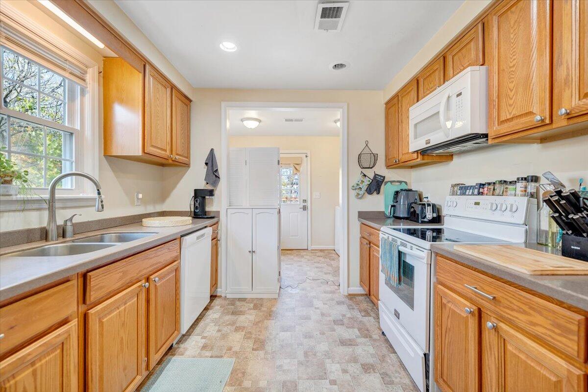 4915 Hildebrand Road Northwest Roanoke, VA 24012 - Photo 10 of 40 a kitchen with granite countertop a sink and a stove