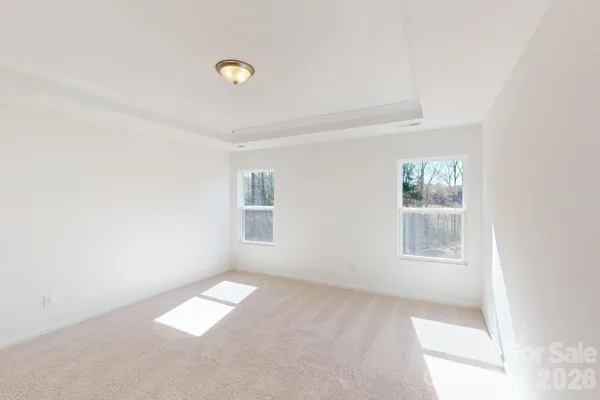 a view of empty room with windows